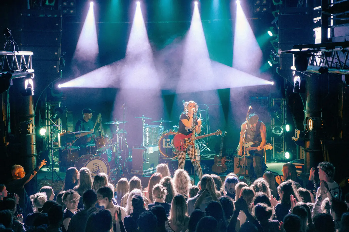 The Pinpricks on stage in front of a crowd